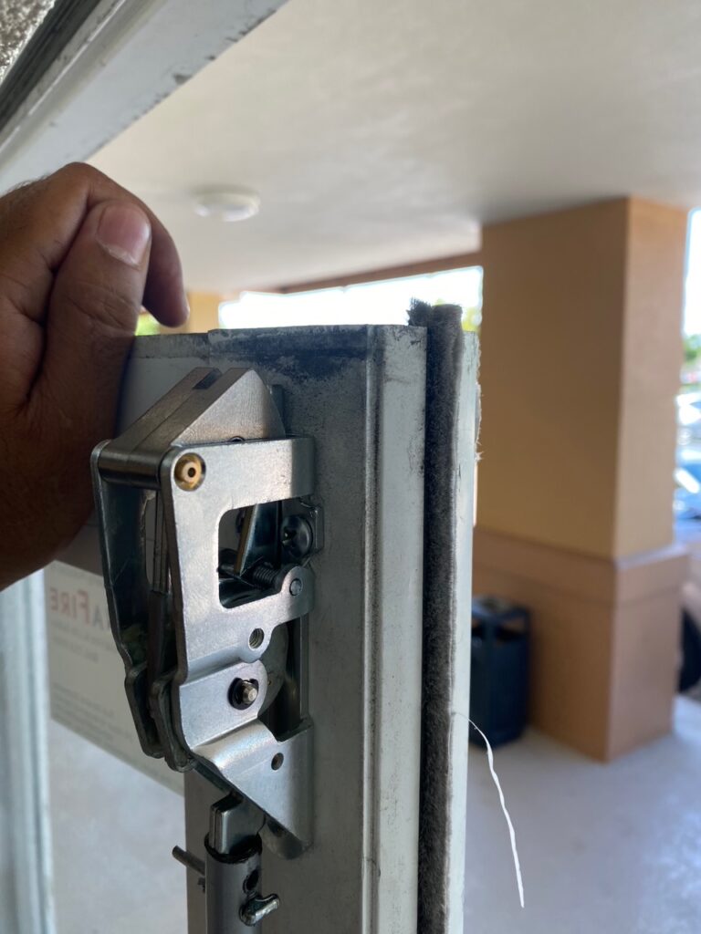 Installation of a Falcon 19–R-EO Narrow Stile Top Latch exit device by 24/7 Super Locksmith, the expert Commercial Locksmith in West Palm Beach, FL. Our technicians specialize in commercial door hardware and high-security Lock Repair in Delray Beach, FL.